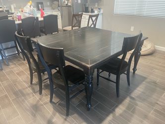 Black used dining table and chairs