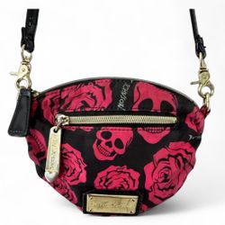 Edgy crossbody with bold skull and rose design. Perfect for a standout look. Easy to carry and stylish.  This mini crossbody was loved (fair pre-loved