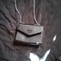 This item is a Prada Monochrome Saffiano Leather Shoulder Bag