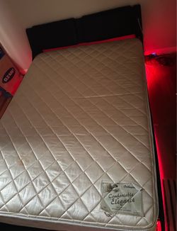 Queen bed with LED lighting underneath