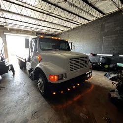 1996 International 4700 T444E Flatbed Tow Truck