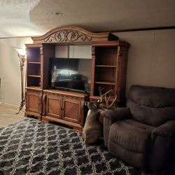 Ashley Furniture 4 Piece Entertainment Center With Light Above The TV and Lots Of Storage Space Below