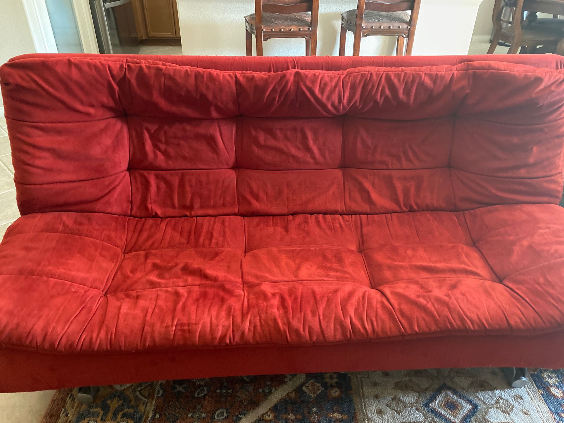 red foldable futon couch