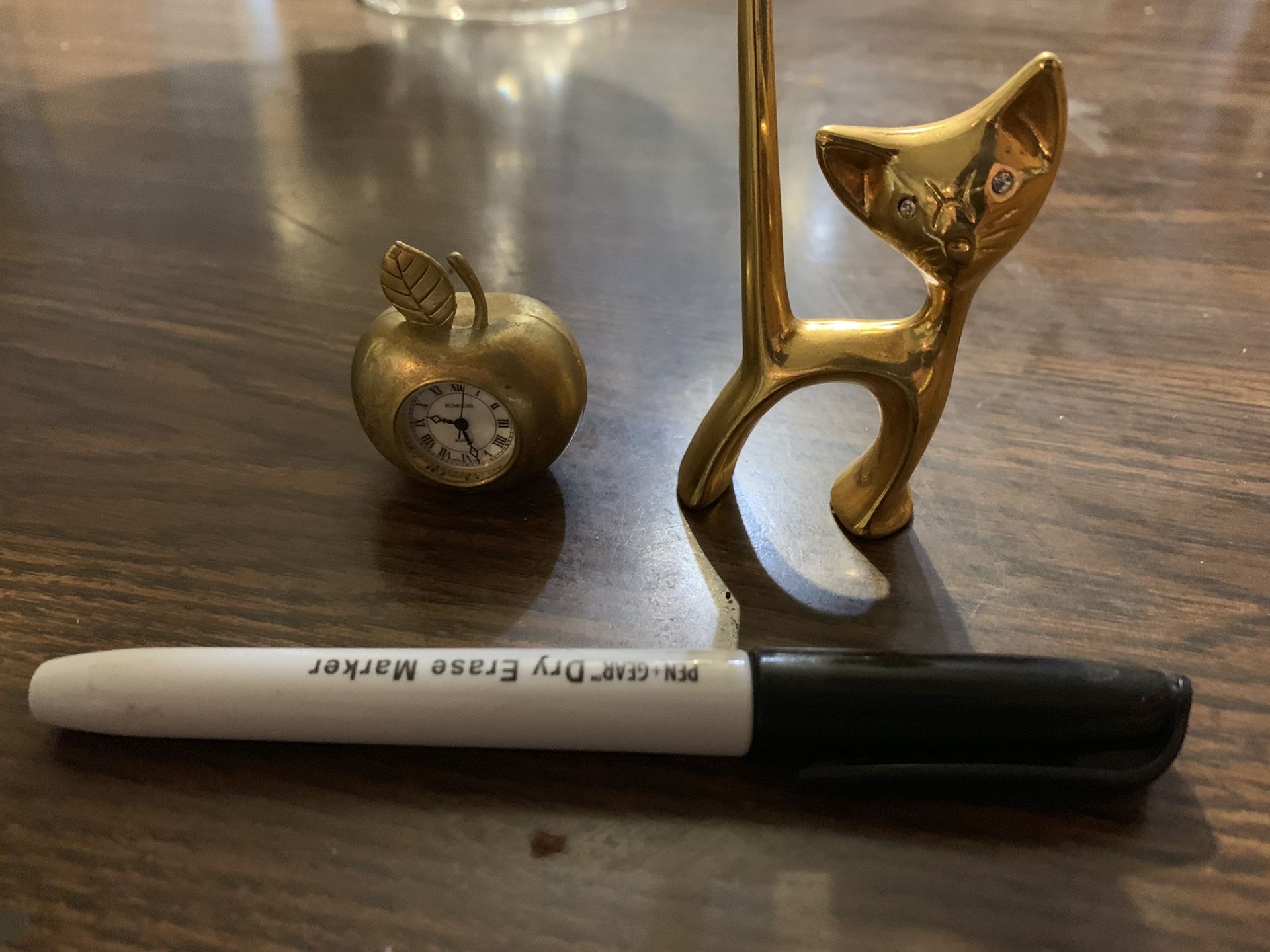Miniature brass apple clock and cat