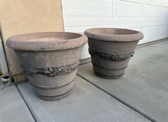 Two large concrete planter pots