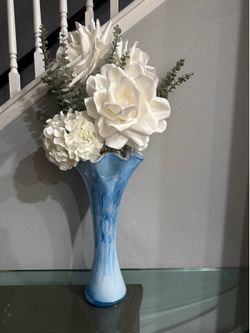 Blue vase with flowers