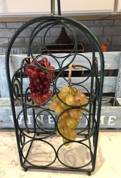 Metal bottle rack wine grapes