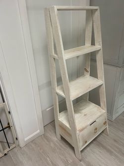 White washed wood ladder shelf with drawer