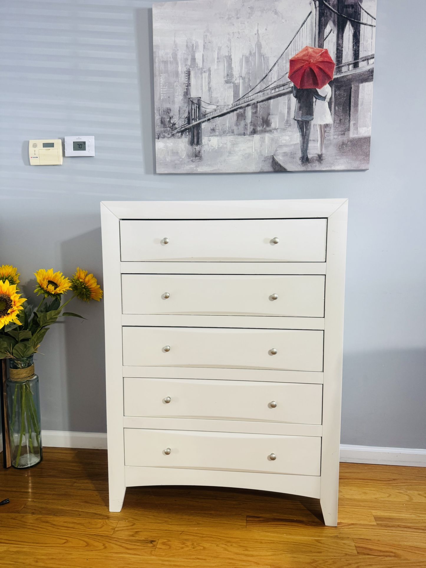 very beautiful wooden white chest of drawers with 5 drawers