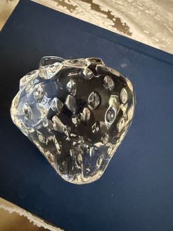 Vintage Clear Glass Beautiful Strawberry Paperweight This solid glass piece has a textured surface representing seeds and molded leaf details at the