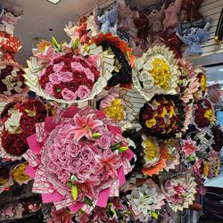 Vibrant artificial flower bouquets. Many different styles and colors available. Red, yellow, pink, white, black, blue, purple roses. Some bouquets hav