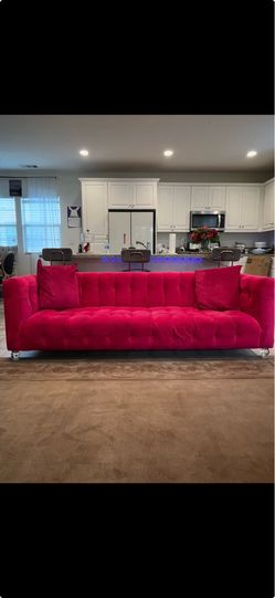 Tufted fusia pink sofa