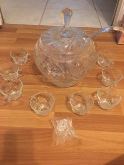 Beautiful Crystal punch bowl, cups, hooks, ladle, lid. 