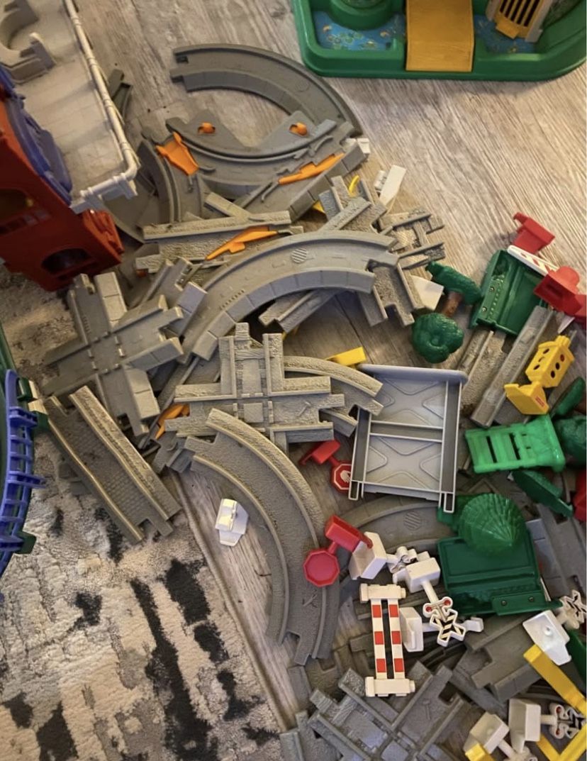 Does not have trains but has a huge amount of geotrax track sets. Throwing in a castle if wanted as well.