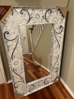 New - Large very detailed mirror with unique decoration.
