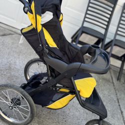 graco jogging stroller (three-wheel design with a tray and canopy).