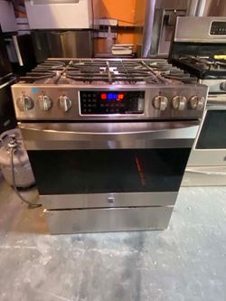 GENERAL ELECTRIC 5-BURNERS FLAT STOVE STAINLES STEEL. FREE DELIVERY AND INSTALLATION