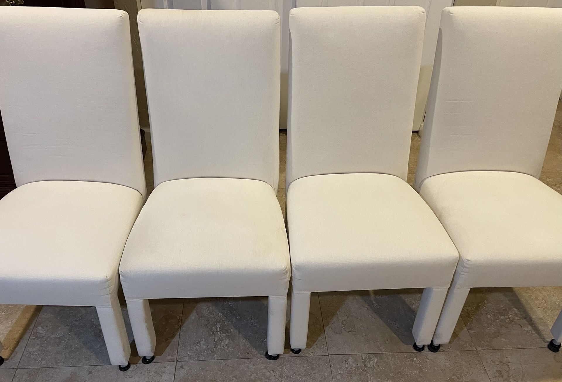 4 Uncovered Chairs + 4 Covers  Included.