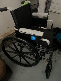BRAND NEW WHEEL CHAIR NEVER USED