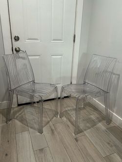 2 clear office chairs