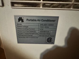 Portable air conditioner with all the stuff needed.
