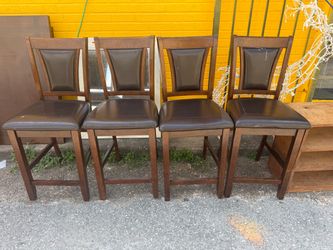 Brown wooden dining set with 4 chairs