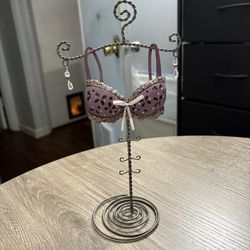 Silver-colored twisted metal bra and beads earring/jewelry holder 