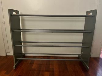 Wooden shoe rack with metal dowels $30