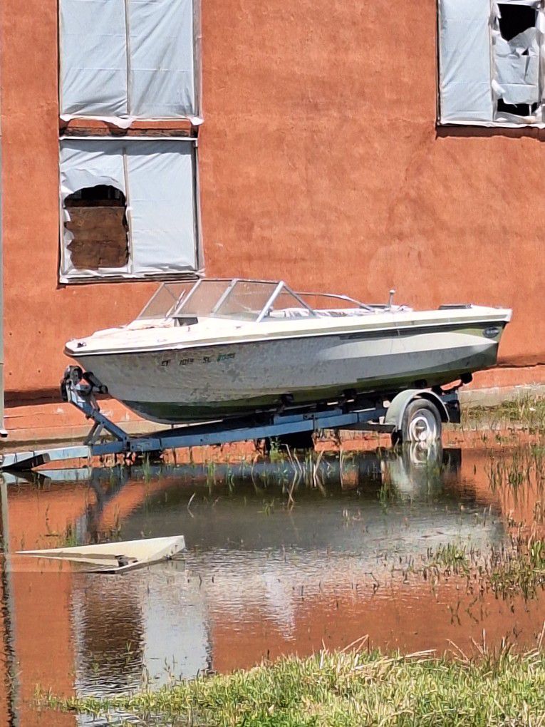 Small Boat And Aluminum Trailer 