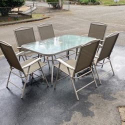 Patio Table And Six Folding Chairs
