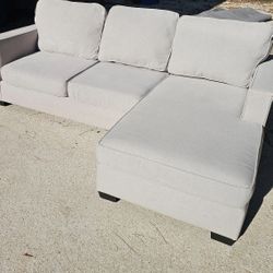 Living Spaces Egan II Reversible Chaise Sofa in Cement Gray