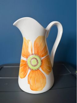 White ceramic floral pitcher