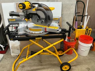 DEWALT dual bevel 12”sliding compound miter saw on rolling stand