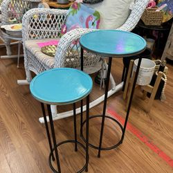 Blue and black plant stands