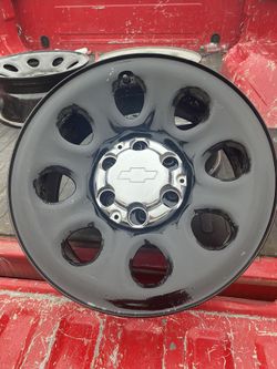 17x8 6 bolt Chevy rims and center caps