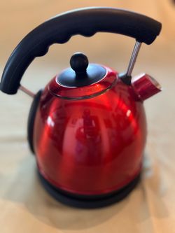Red metal teapot plug-in
