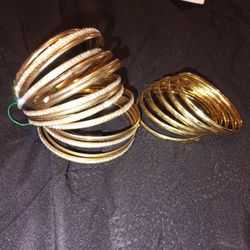 Two Gold Tone Bracelets, 