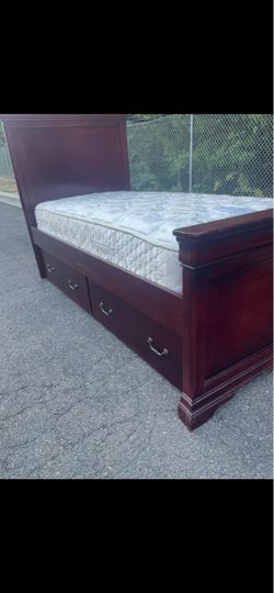 Real wood full size bed with drawers.