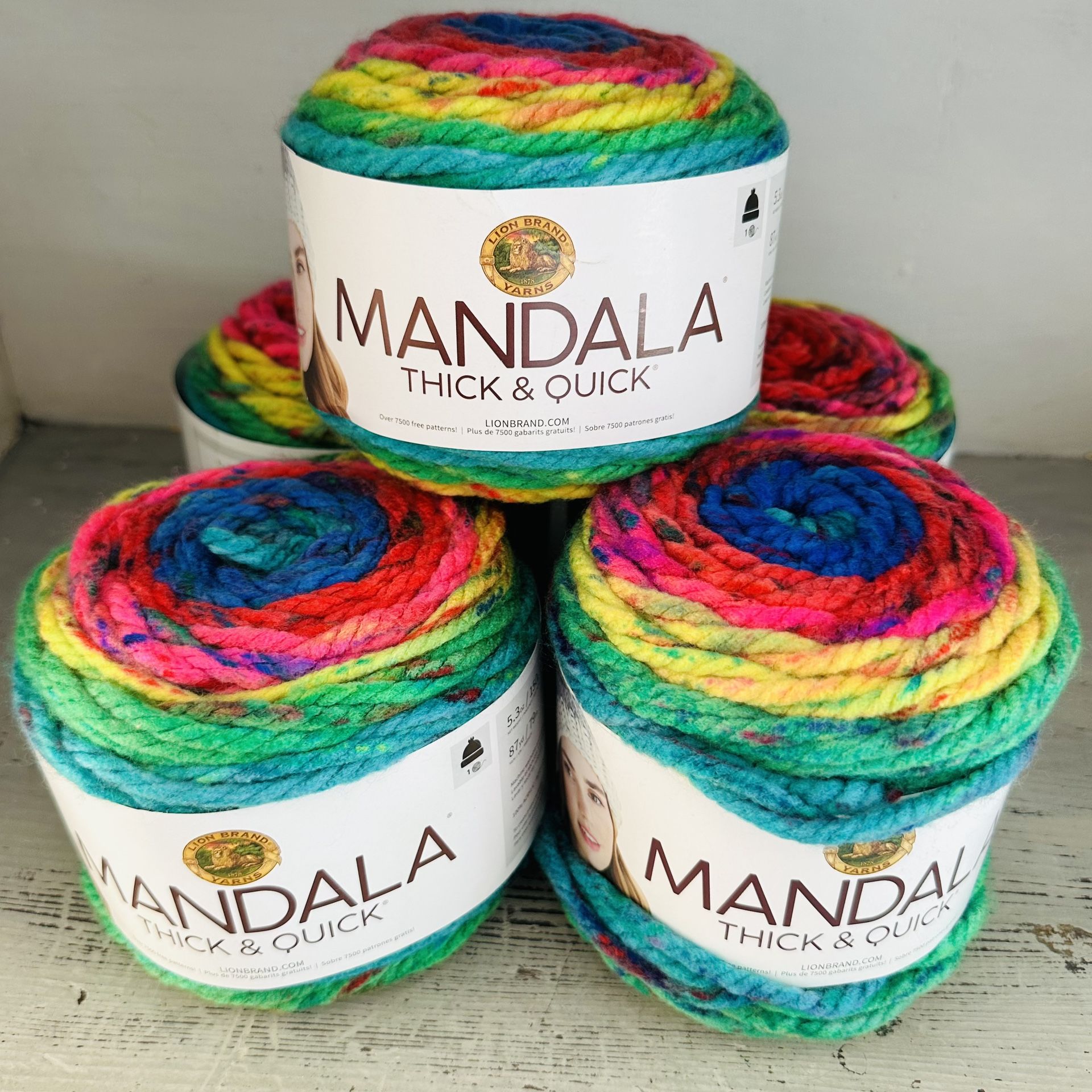 Five rolls of mandala thick and quick lion brand yarn each is 5.3 oz, 87 yards. 100% acrylic Swirl tourbillion color . Unused.