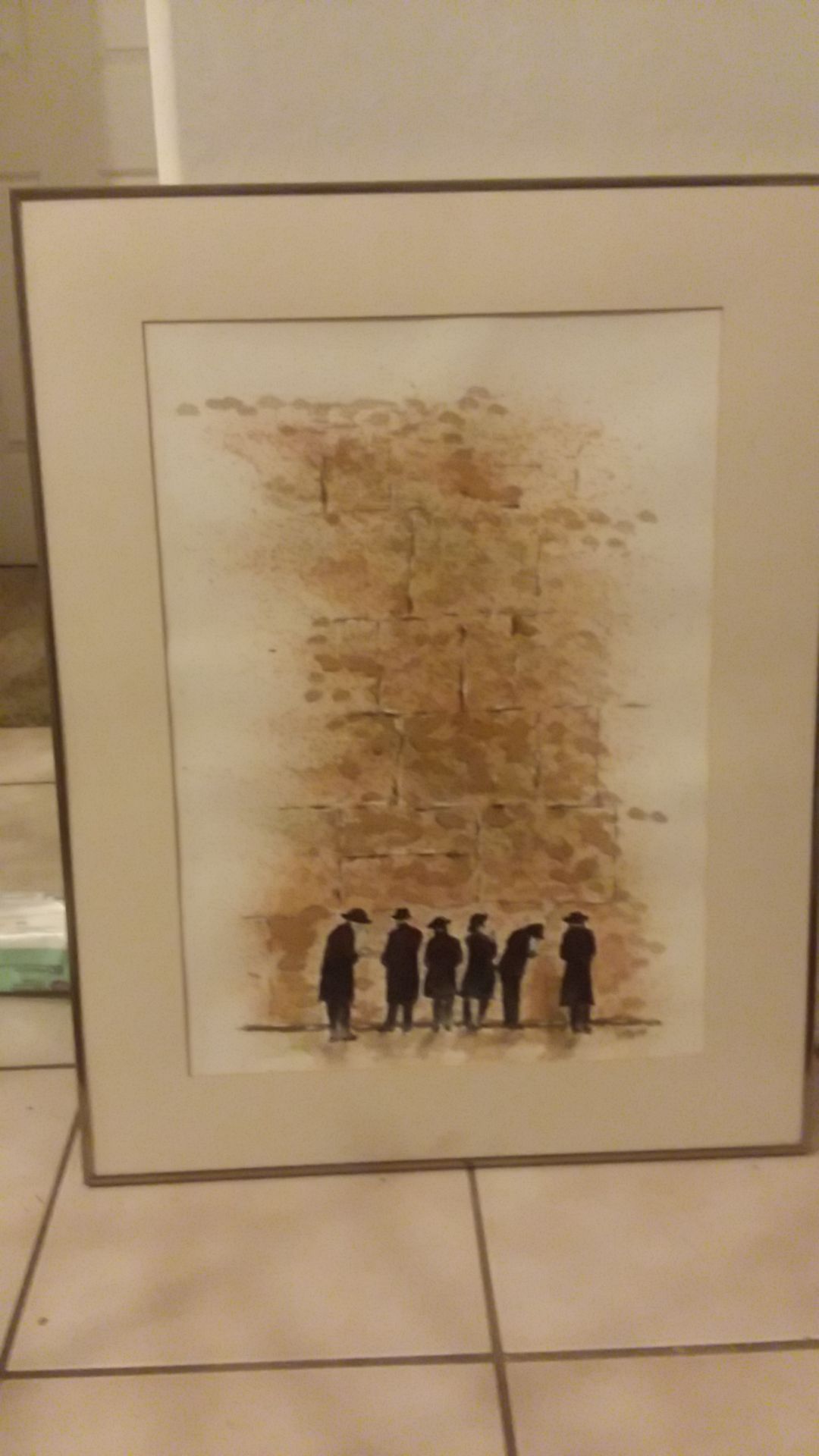 5 Jewish priest looking at a famous wall