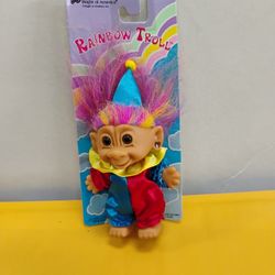 Vintage Bright of America "Rainbow Troll" clown doll, featuring signature colorful hair and a jester costume. 