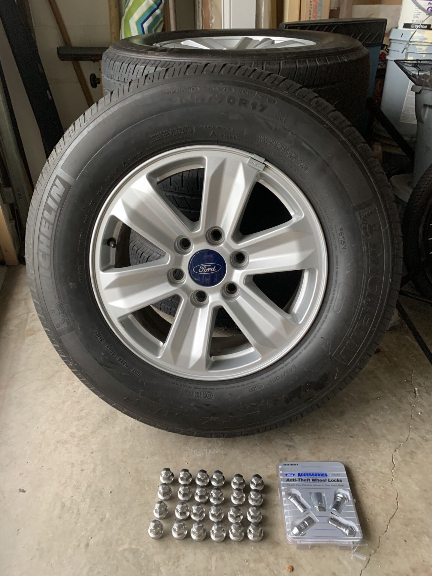 F-150 tires, rims & locking lugs with key.