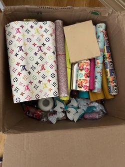 Box full of vinil and more for bow making