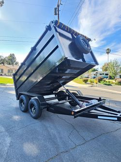 NEW DUMP TRAILERS 12x8x4 ROLLING TARP AND SPARE TIRE 2026 YEAR ELECTRIC BRAKES LIGHTS REMOTE CONTROL TITLE IN HAND READY FOR WORK,se habla ESPAÑOL