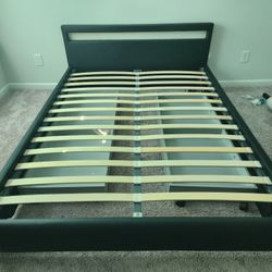 Modern queen size bed frame with comfortable mattress