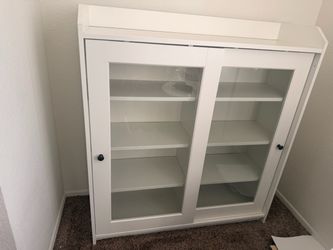 Media cabinet with glass doors