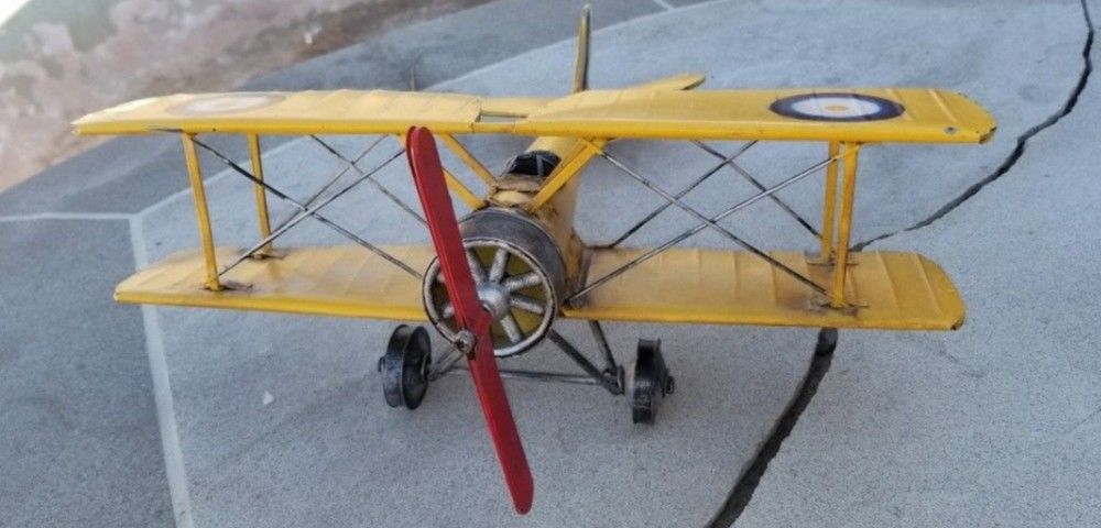 Vintage metal Yellow airplane. Cool piece!