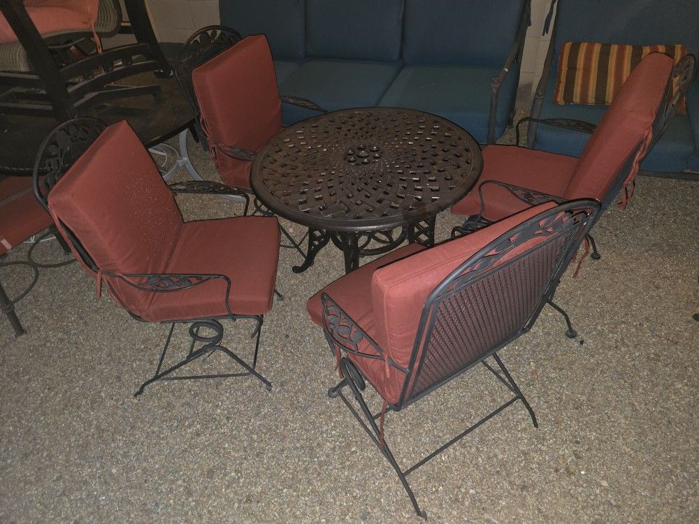 $300  IRON PATIO SET 4 ROCKING CHAIRS AND TABLE 