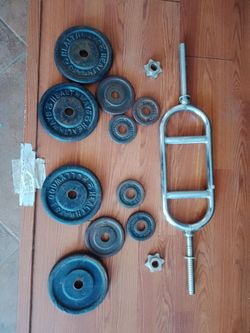 Tricep bar and  50 lbs in various plates