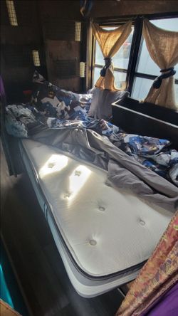 Kids Twin Mattress with pillow top. Comes with Batman sheets.